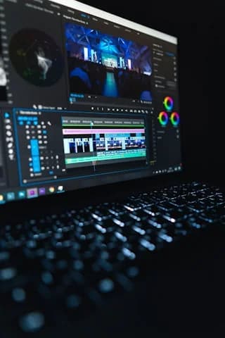 Video editing timeline glowing on a laptop